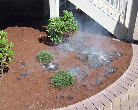 mulch on fire next to home
