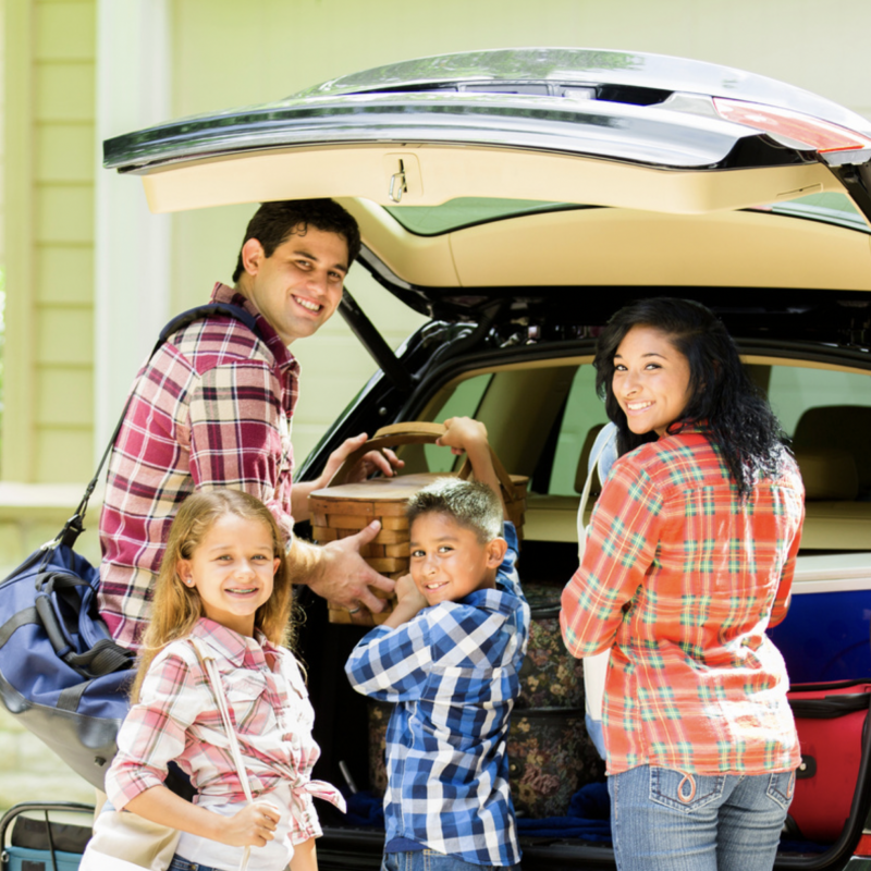 Family packing a car