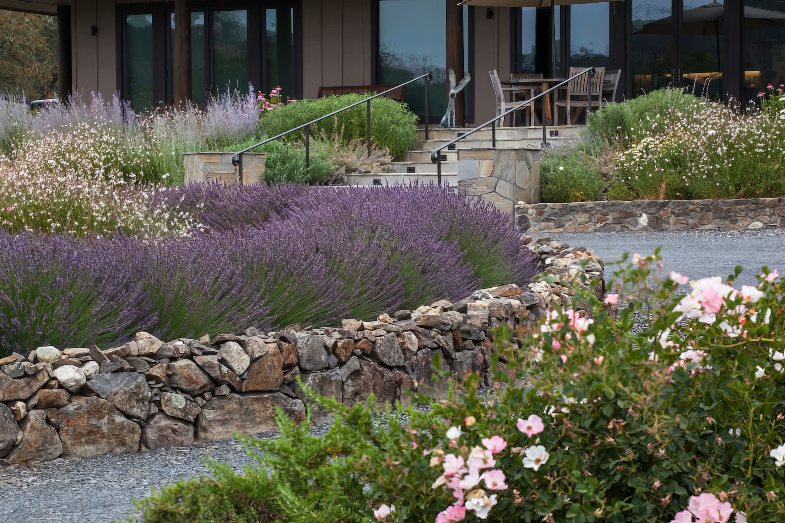 Island bed with stone walls, a home hardening and dis-continuous vegetation - Fire safety protection, country garden, Sonoma California