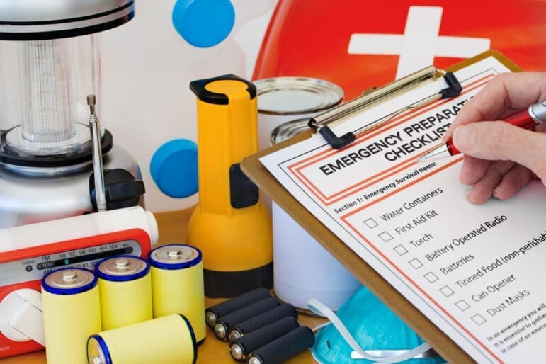 someone filling out an emergency preparation checklist