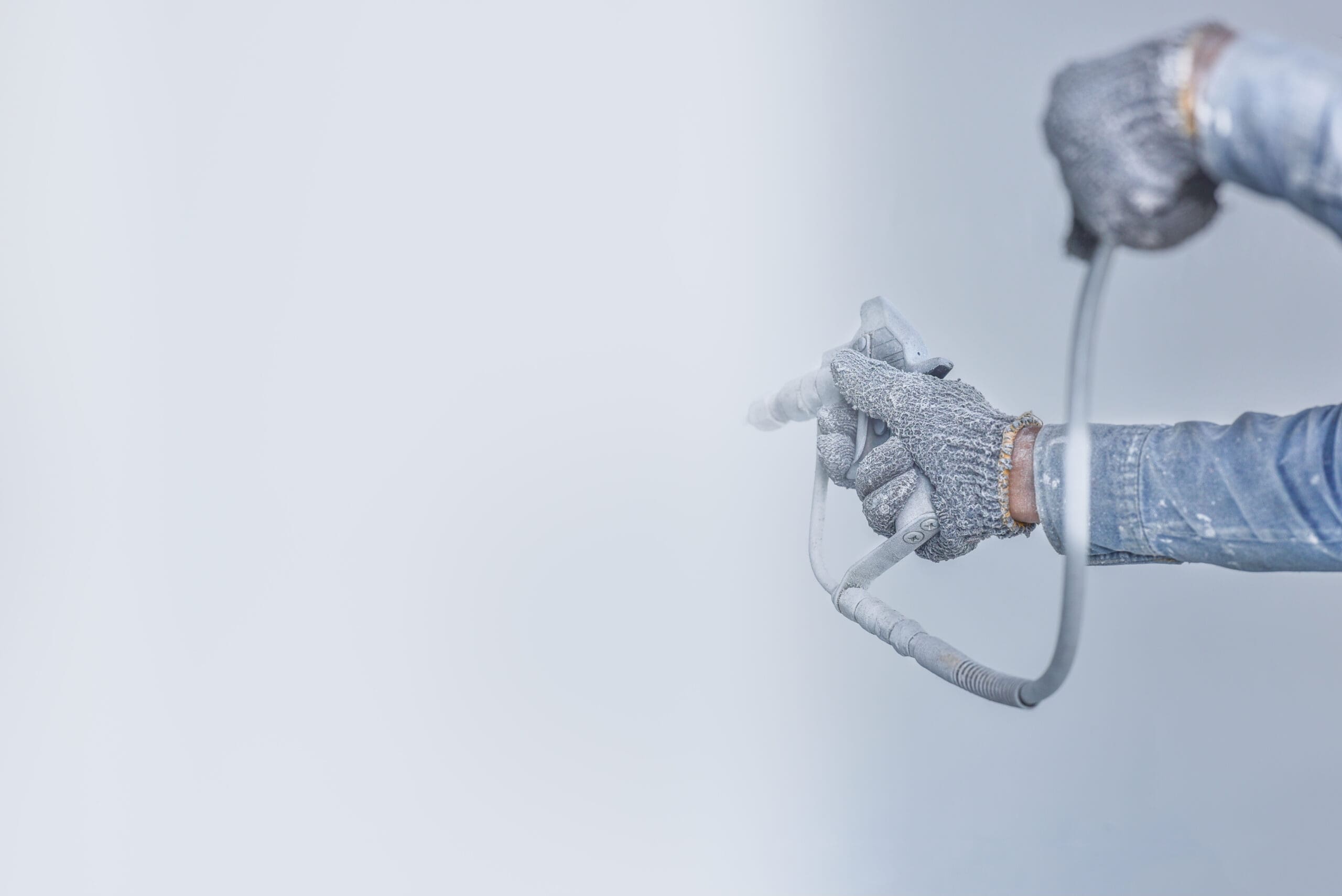 Airless,Spray,Painting,,Worker,Painting,On,Steel,Wall,Surface,By